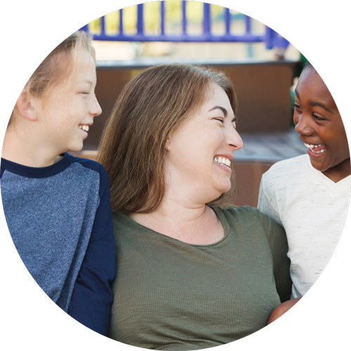 Woman smiling at two sons