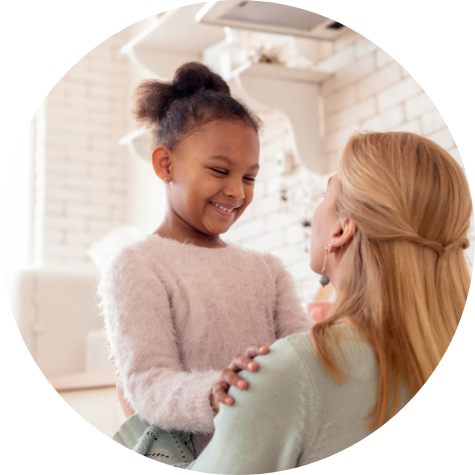 Child smiling at woman