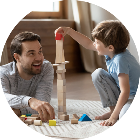 Father and son playing with wooden blocks