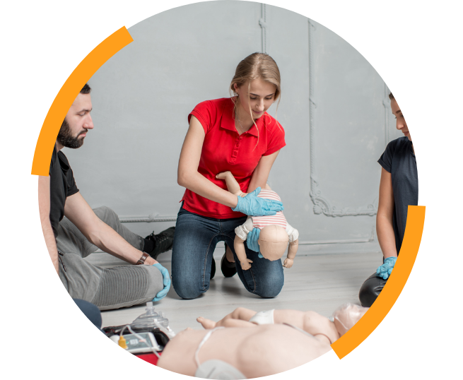 Woman giving CPR to fake baby