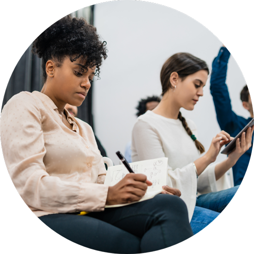 Women focusing writing notes